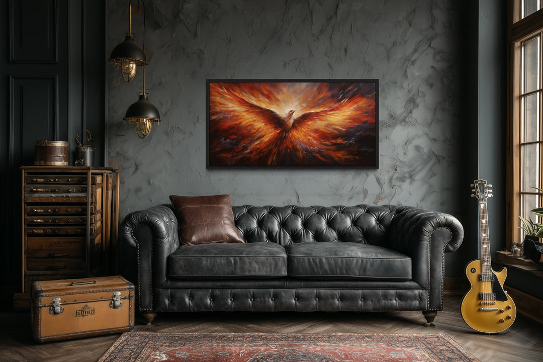 Rising Phoenix extra large orange framed canvas wall art above a black leather sofa in a living room