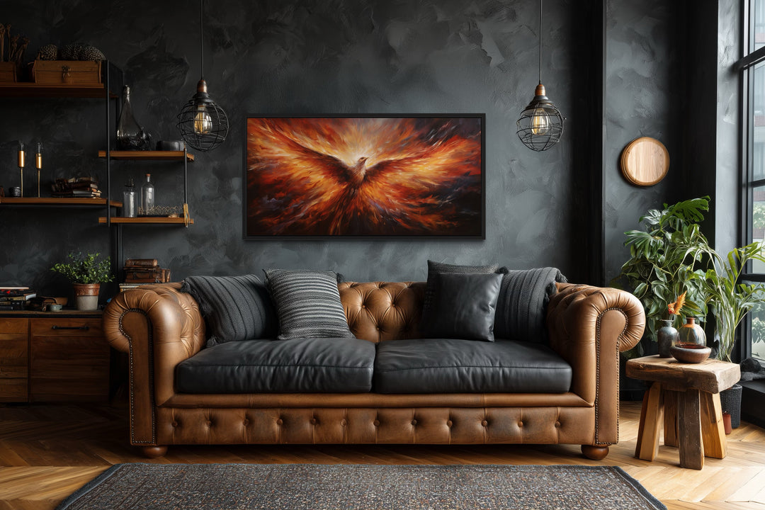 Rising Phoenix extra large framed canvas wall art in orange and red above a brown leather sofa.