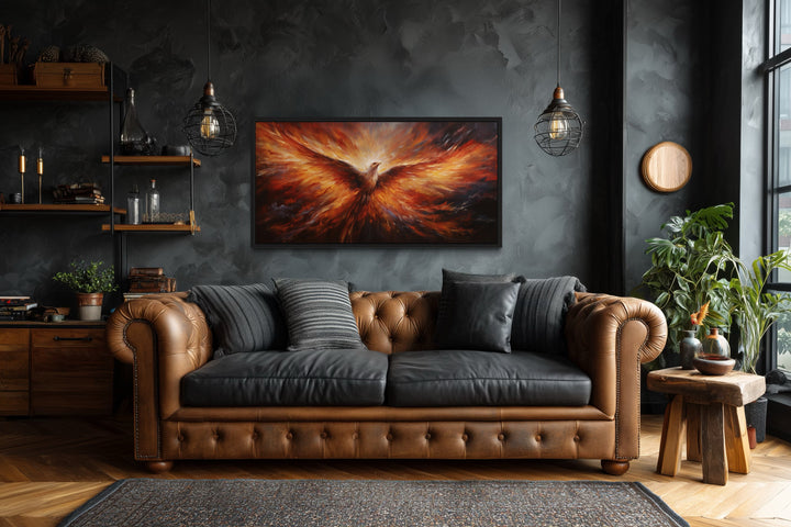 Rising Phoenix extra large framed canvas wall art in orange and red above a brown leather sofa.