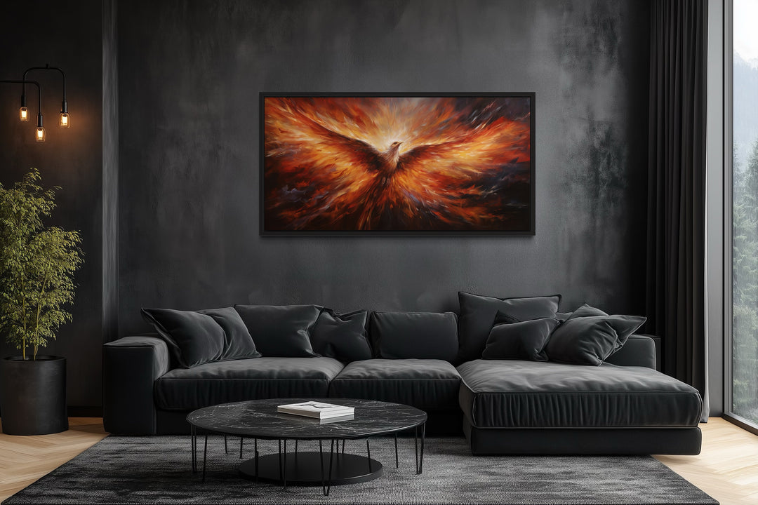 Rising Phoenix extra large orange framed canvas wall art above a black sofa in a modern living room.