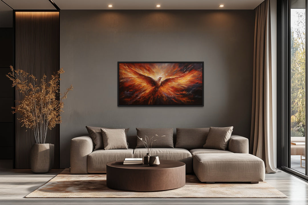 Rising Phoenix extra large framed canvas wall art in a modern living room above a brown sofa.