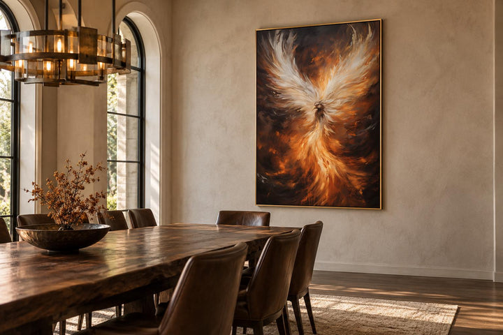 Rising phoenix framed canvas wall art in a dining room with a large wooden table and leather chairs.