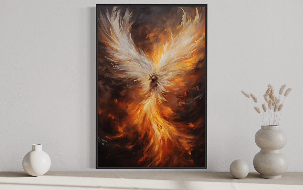 Rising Phoenix framed canvas wall art featuring a fiery bird in orange, gold, and white tones.