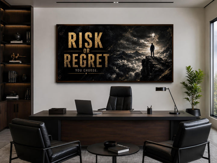 Risk or Regret black and gold motivational wall art in a modern office with a dark wood desk.