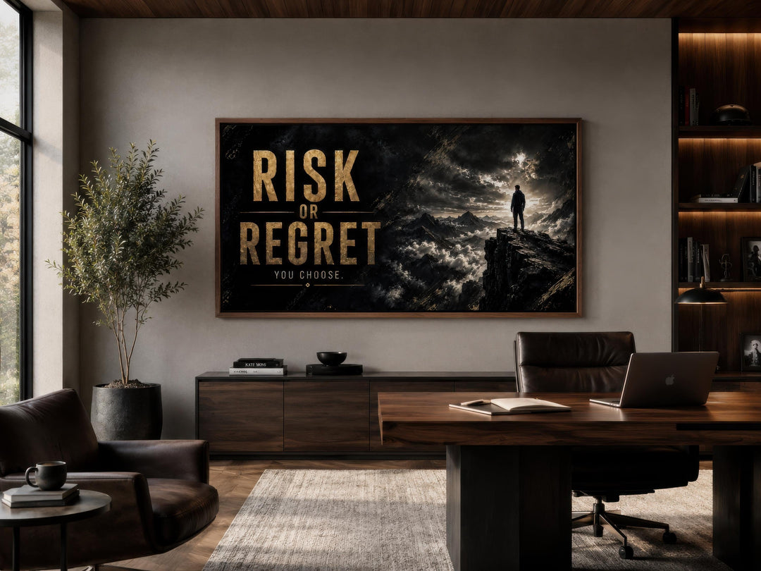Risk or Regret motivational wall art in a black and gold palette above a desk in a modern office.