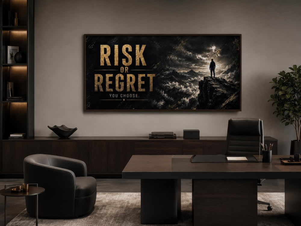 Risk or Regret motivational wall art in gold lettering on a dark mountain landscape in a home office