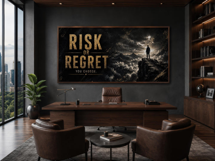 Risk or Regret motivational wall art in black and gold above a desk in a modern office.