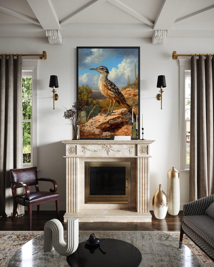 A vertical canvas print of a roadrunner perched on a desert rock above a classic fireplace mantel.