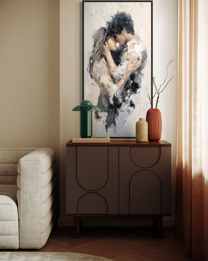Vertical canvas wall art featuring an abstract painting of a couple in a romantic embrace.