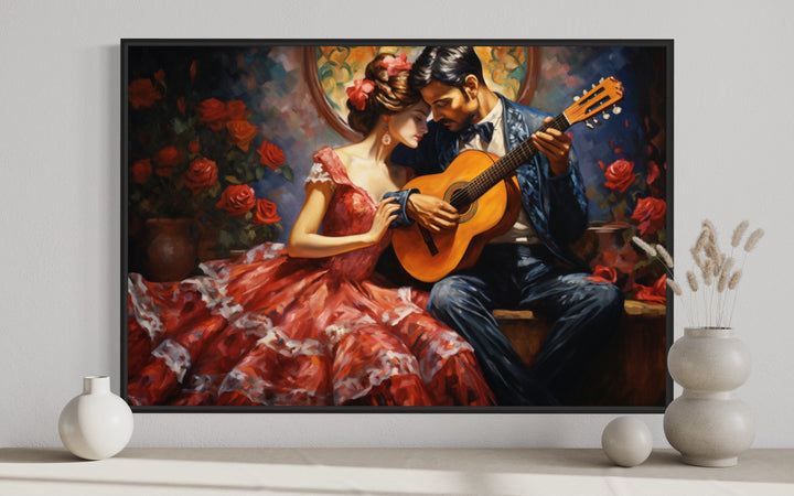 Framed canvas wall art of a romantic couple with a guitar in traditional Mexican attire.