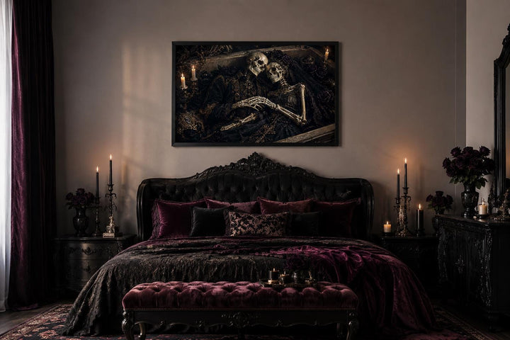 Gothic skeleton couple artwork in an ornate coffin frame hanging above a dark velvet bed.