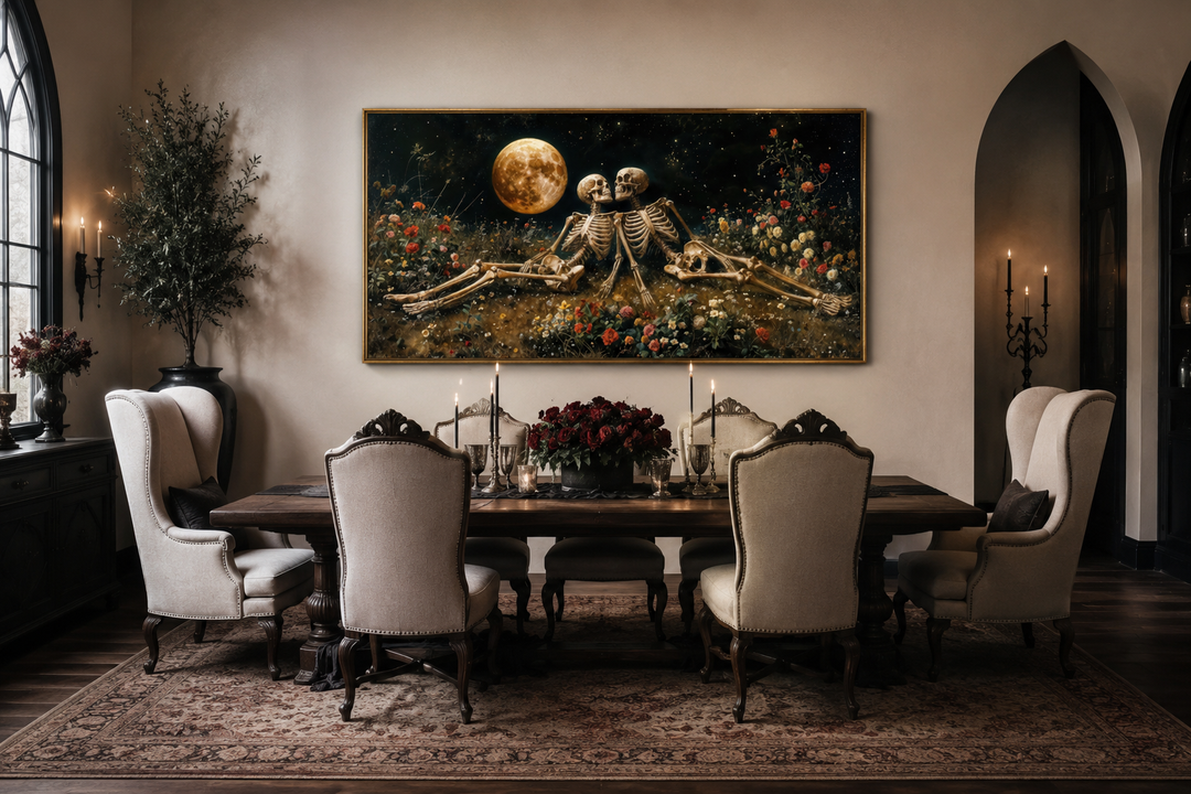 Gothic wall art of two skeletons in a floral meadow under a full moon above a dining table.