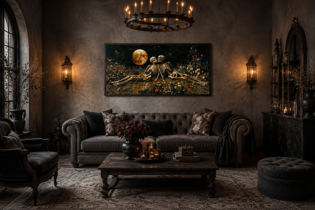 Gothic wall art of two skeletons in a flower meadow under a full moon above a dark sofa.