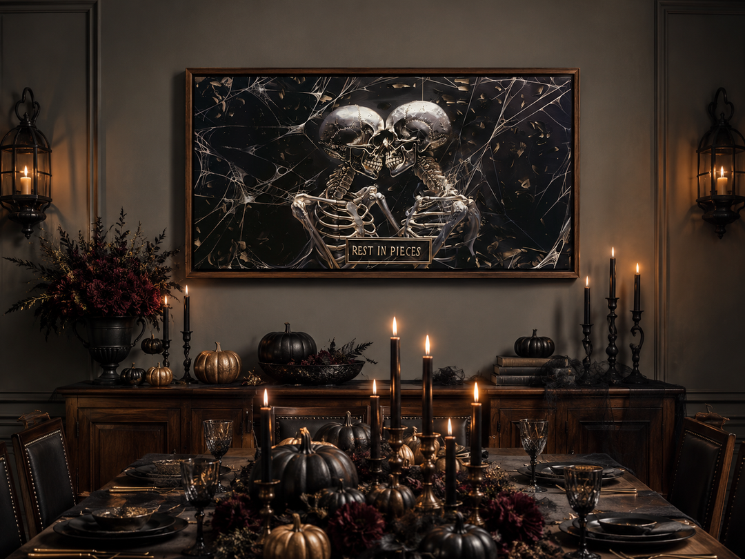 Gothic wall art of two skeletons with a 'Rest In Pieces' plaque above a Halloween dining table.