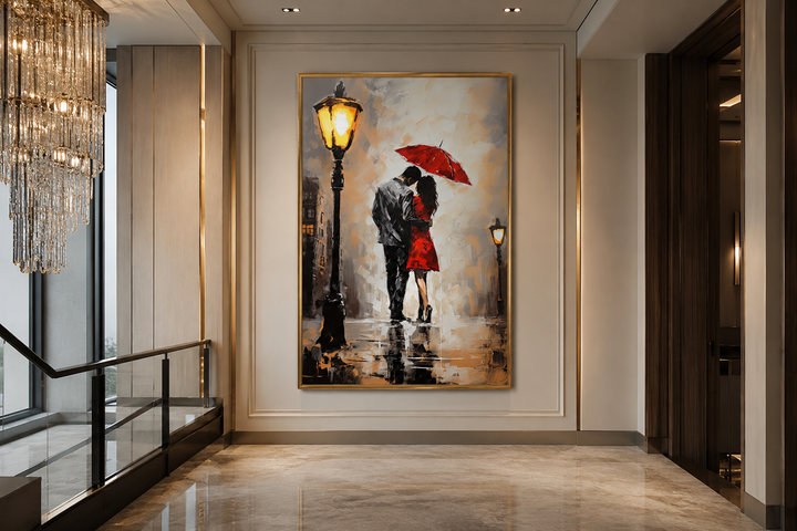 Framed canvas wall art of a couple under a red umbrella in the rain, hung in a modern hallway.