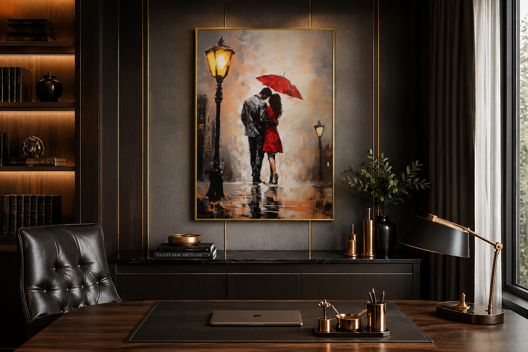 Framed canvas wall art of a couple under a red umbrella in the rain, hung in a dark wood office.