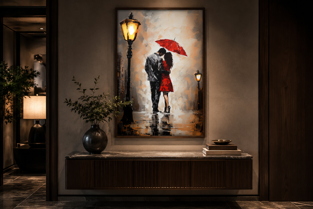 Framed canvas wall art of a couple under a red umbrella in the rain, hanging above a wooden console.