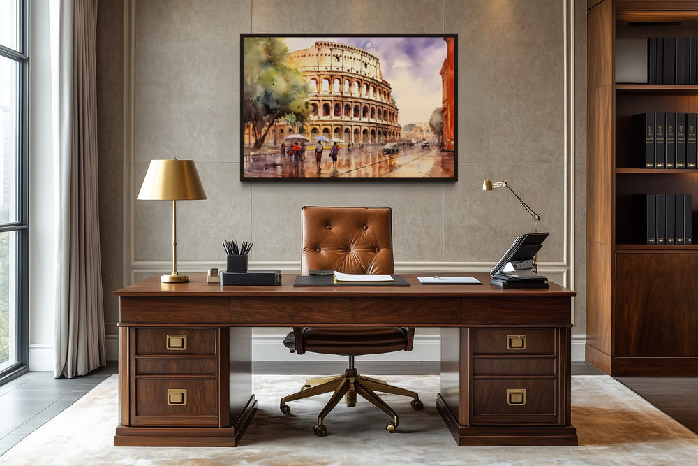 Vintage framed watercolor canvas of the Colosseum in Rome hanging above a wooden office desk.