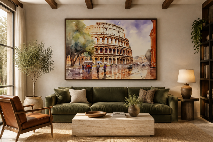 Vintage framed watercolor canvas art of the Colosseum in Rome above a green sofa in a living room.