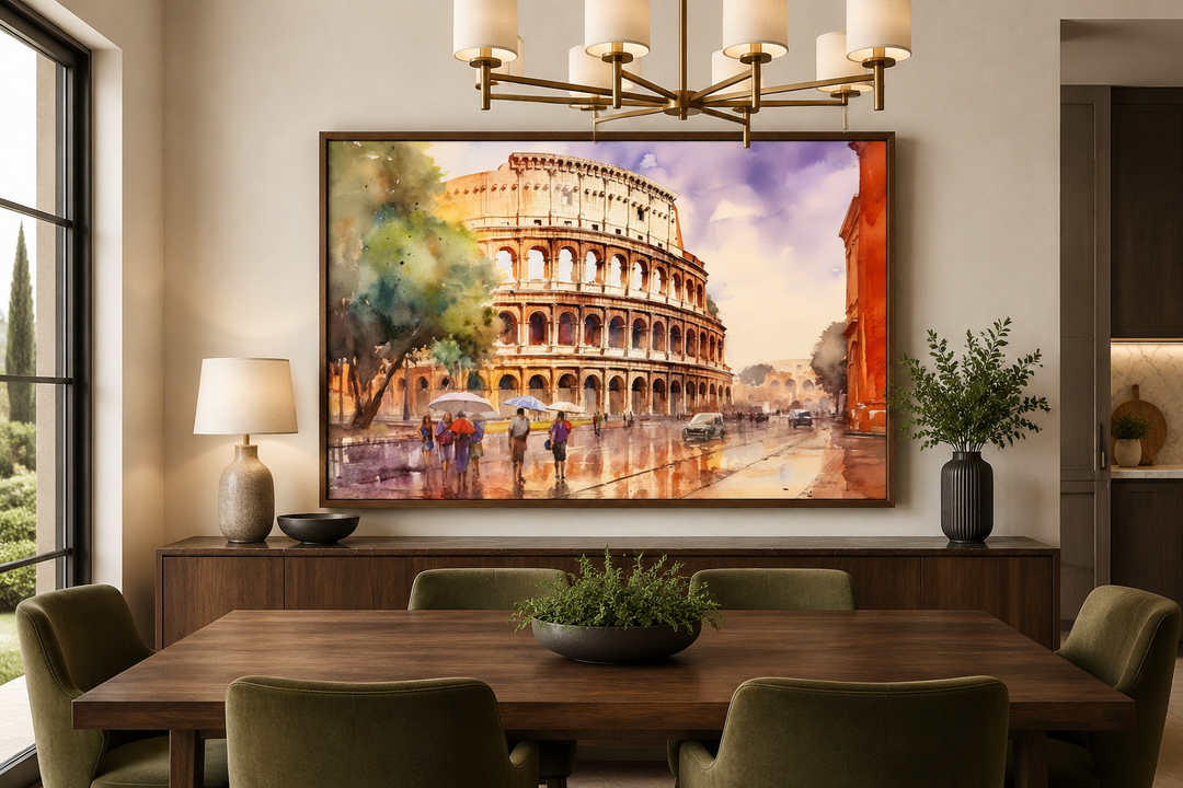 Watercolor painting of the Colosseum in a dark wood frame above a dining table in a modern room.