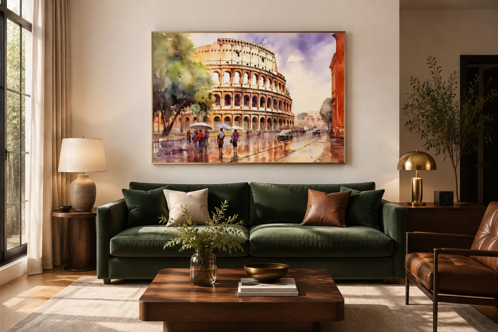 Vintage watercolor framed canvas art of the Colosseum in Rome hanging above a green velvet sofa.