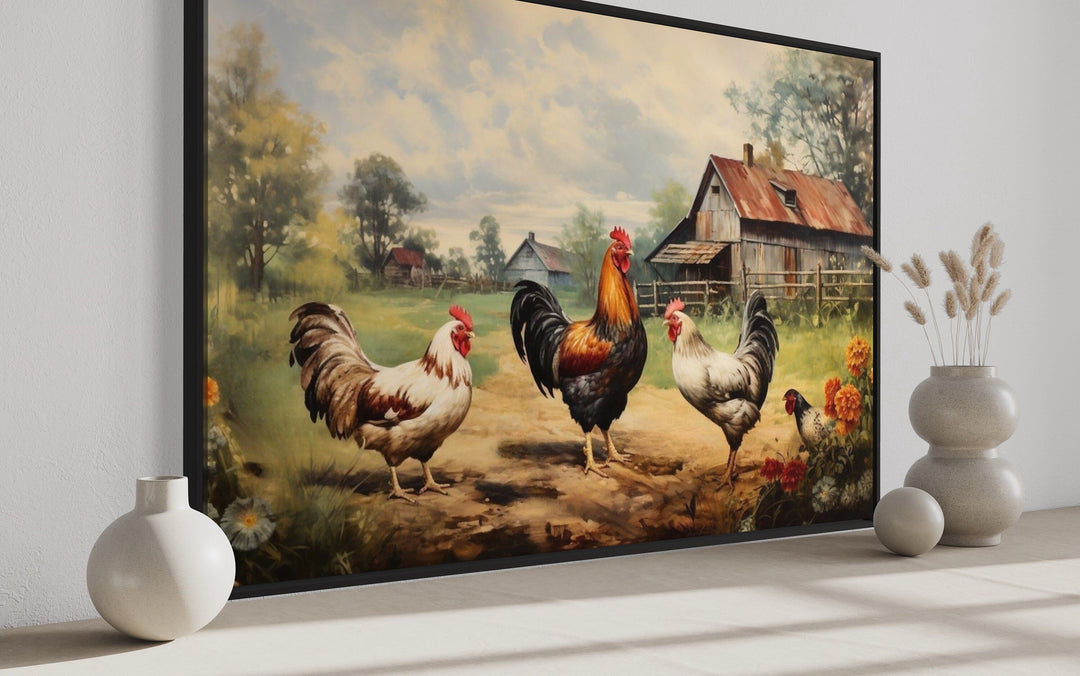Framed canvas wall art of roosters and chickens in a farmyard with a rustic barn and trees.