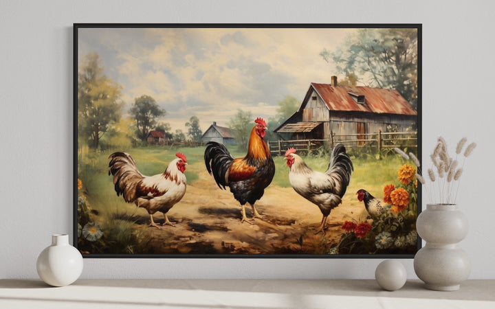 Framed canvas wall art of roosters and chickens in a rustic farmyard with a barn background.