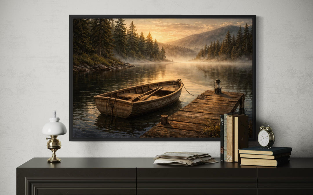 A framed canvas print of a rustic rowboat at a peaceful lake dock during a golden sunset.