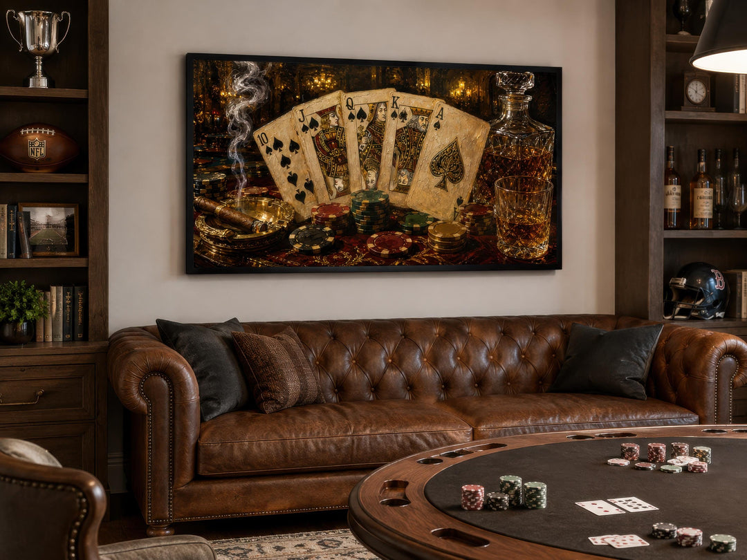 Royal Flush poker canvas wall art hanging above a brown leather sofa in a game room.