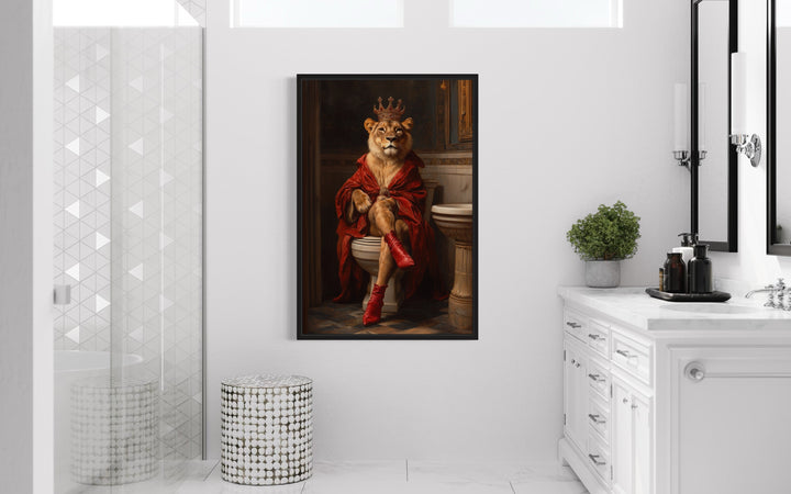 Royal Lioness With Crown Sitting on Toilet Framed Canvas Wall Art in a toilet