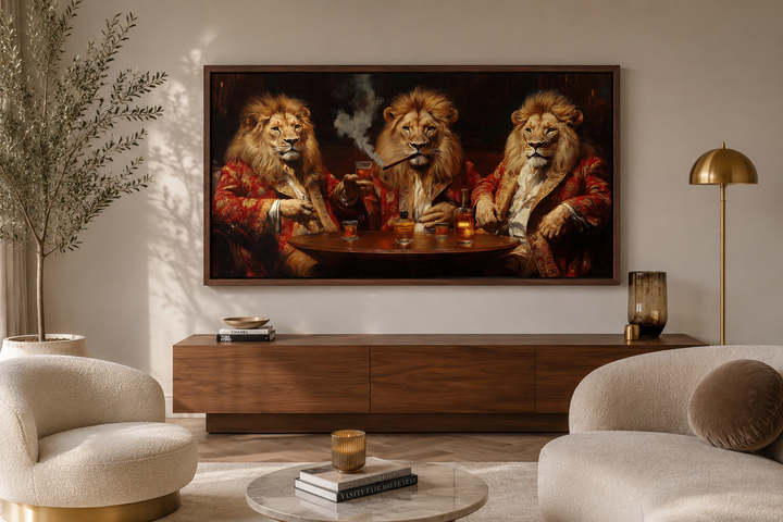 Framed canvas wall art of three lions in royal attire drinking whiskey and smoking cigars.
