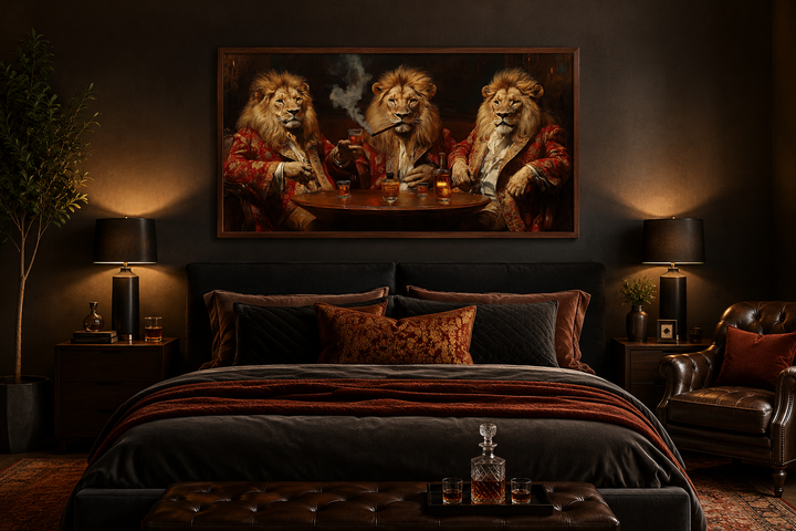 Framed canvas art of three lions in royal attire drinking whiskey and smoking cigars above a bed.