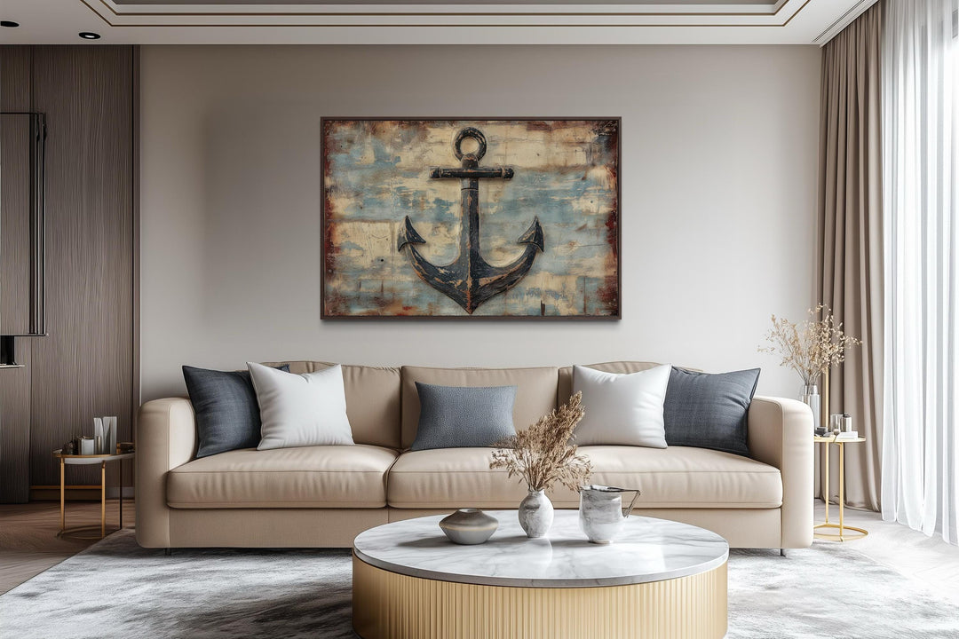 Rustic anchor wall art on a weathered wood-style canvas above a modern beige sofa.