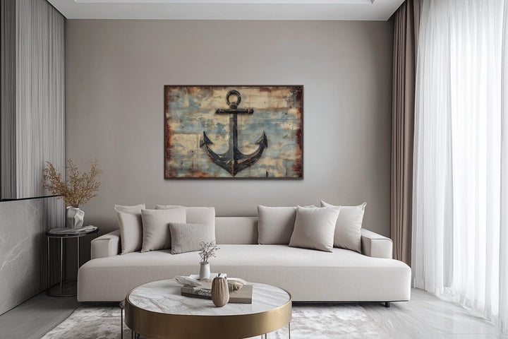 Rustic anchor wall art with a weathered nautical design on canvas in a modern living room.