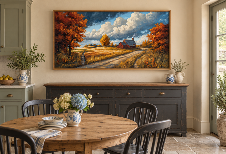 Rustic Autumn Barn Landscape Wall Art in a wooden frame above a dark sideboard in a farmhouse room.