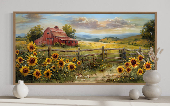 Panoramic rustic wall art featuring a red barn and sunflowers in a golden field with a wood frame.