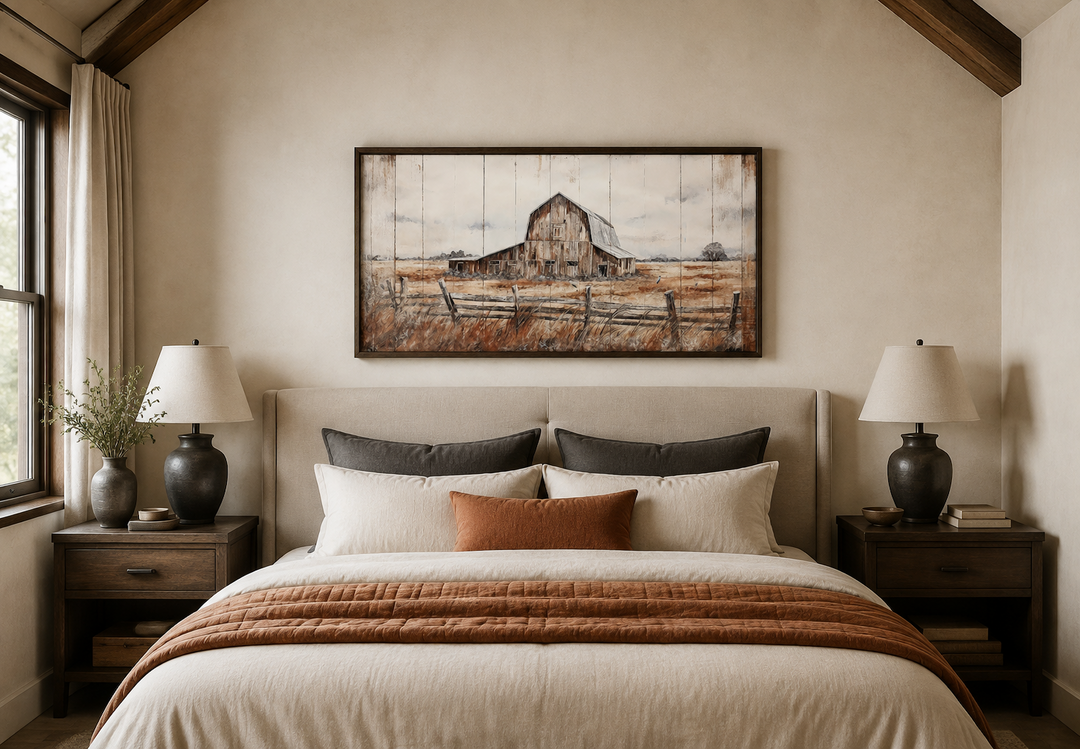 Rustic barn wall art in a dark wood frame hanging above a neutral upholstered bed in a bedroom.