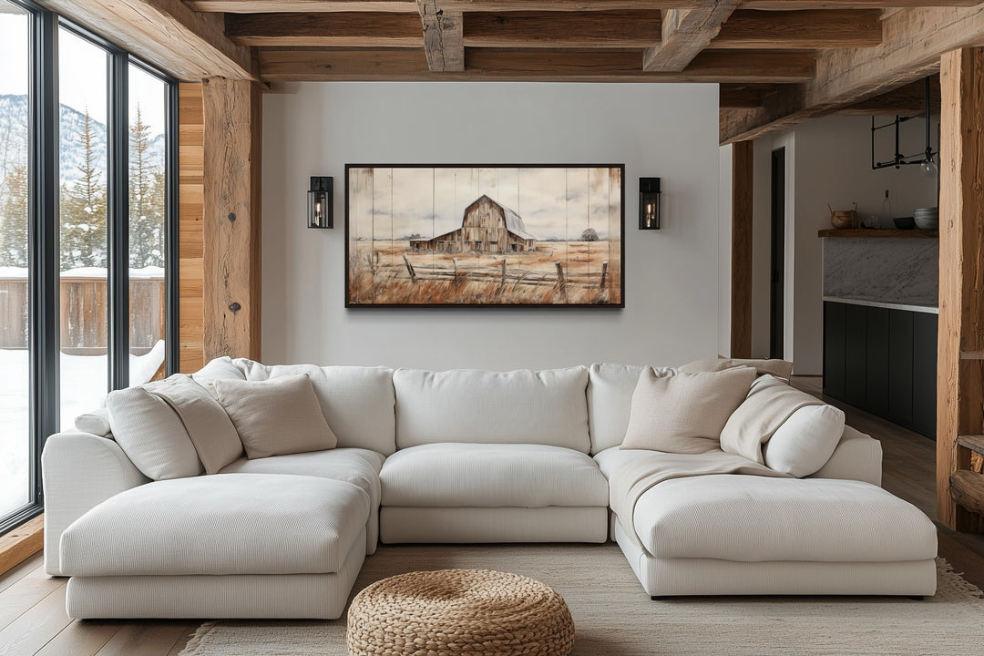 Rustic weathered barn wall art canvas in a farmhouse living room with a white sectional sofa.