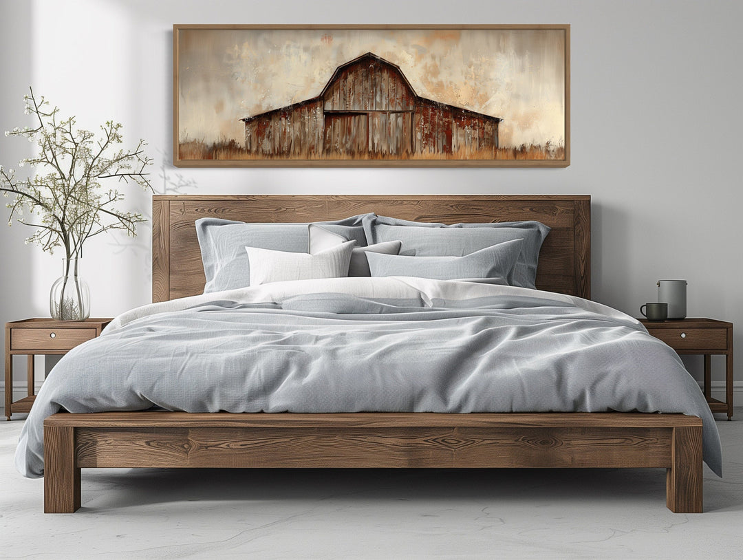 Rustic brown barn panoramic framed canvas wall art hanging above a wooden bed in a bedroom.