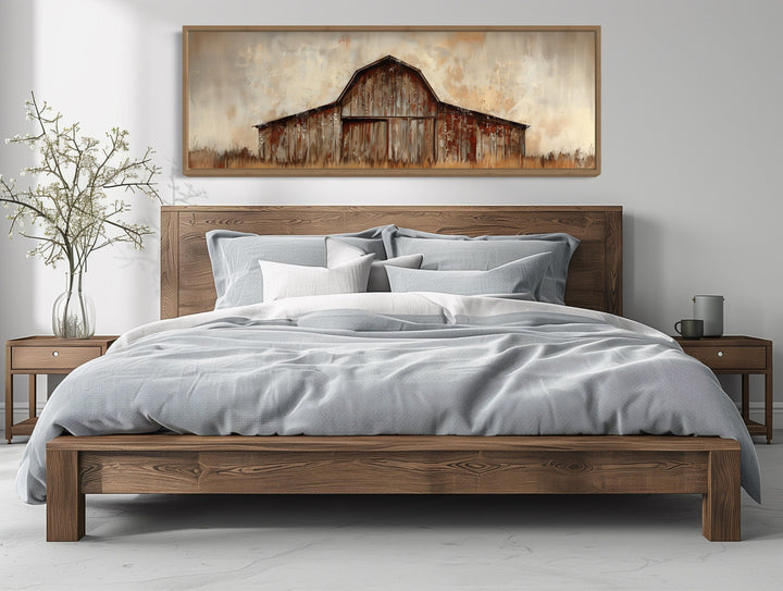 Rustic brown barn panoramic framed canvas wall art hanging above a wooden bed in a bedroom.
