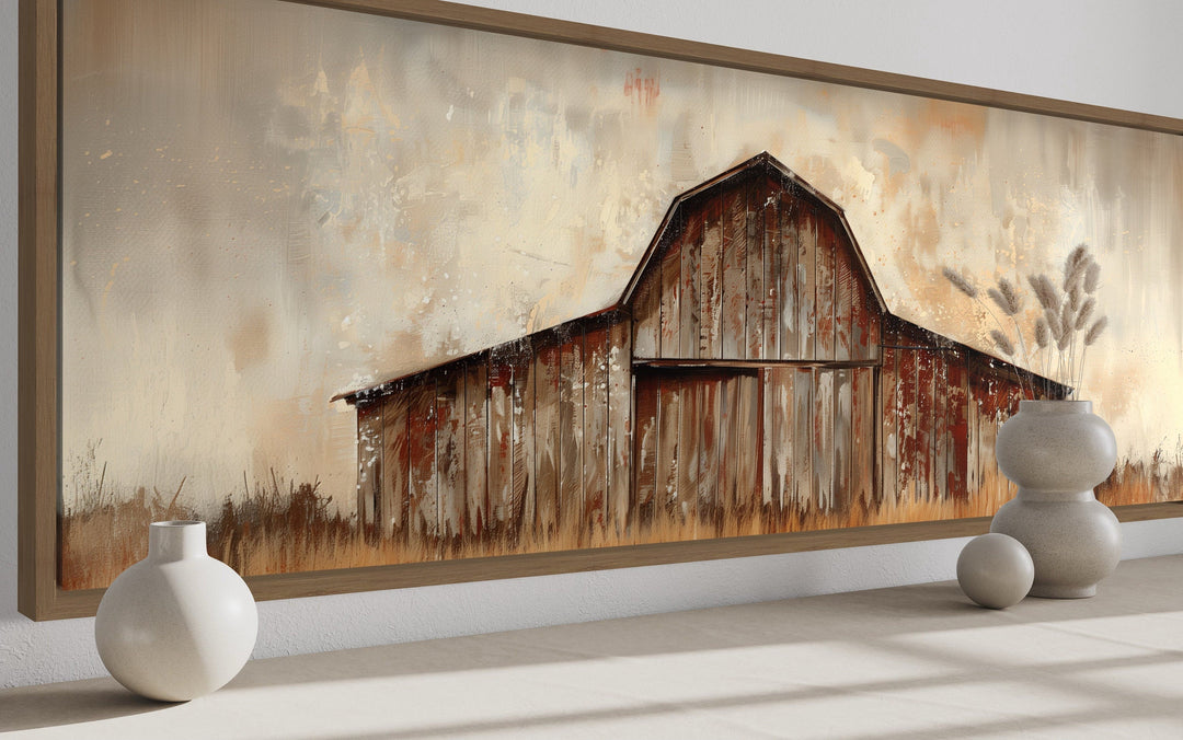 Rustic brown barn panoramic framed canvas wall art in a farmhouse setting with decorative vases.