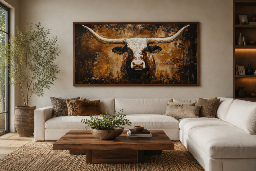 A large horizontal canvas painting of a longhorn bull on an abstract brown and gold background.