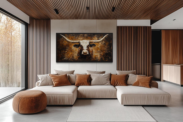 Rustic brown longhorn bull painting on abstract western background canvas wall art in a modern room.