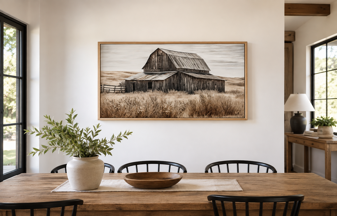 Rustic chic old farm barn painting on wood framed canvas wall art in a farmhouse dining room.