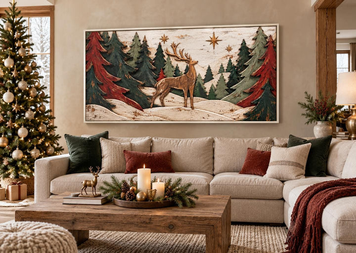 Rustic Christmas deer and evergreen trees framed canvas wall art above a neutral sofa.