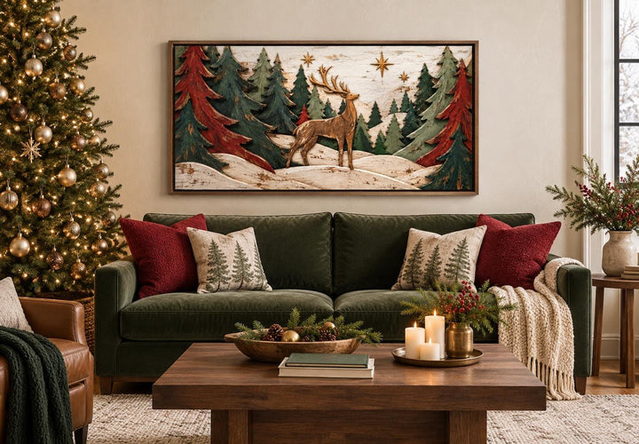 Rustic Christmas deer and evergreen tree framed canvas wall art above a green velvet sofa.