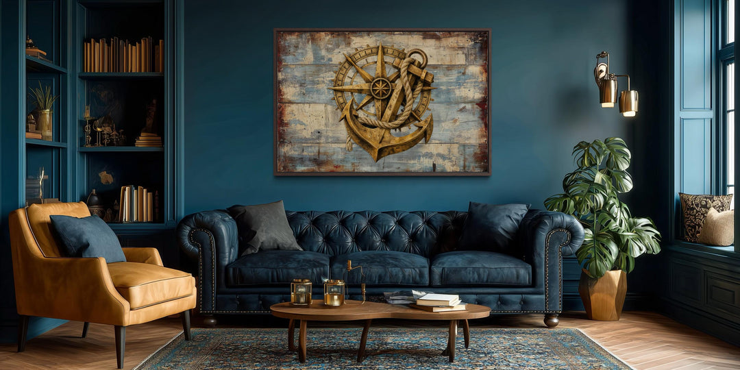 Rustic compass and anchor canvas wall art on weathered blue wood in a dark, moody living room.