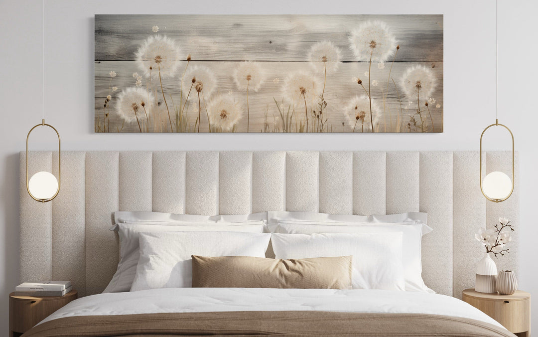 Rustic dandelions painting on wood, long horizontal wall art displayed above a bed.