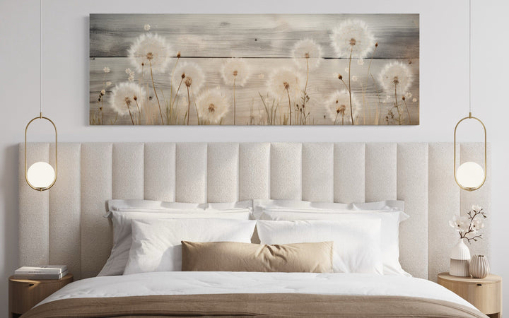 Rustic dandelions painting on wood, long horizontal wall art displayed above a bed.