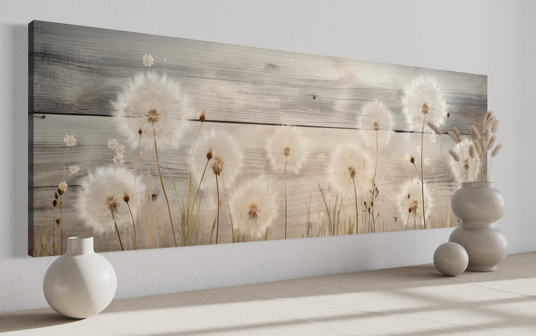 Rustic dandelion painting on wood, long horizontal framed canvas wall art above a shelf.